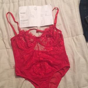 Red lace body suit from Laura’s Boutique